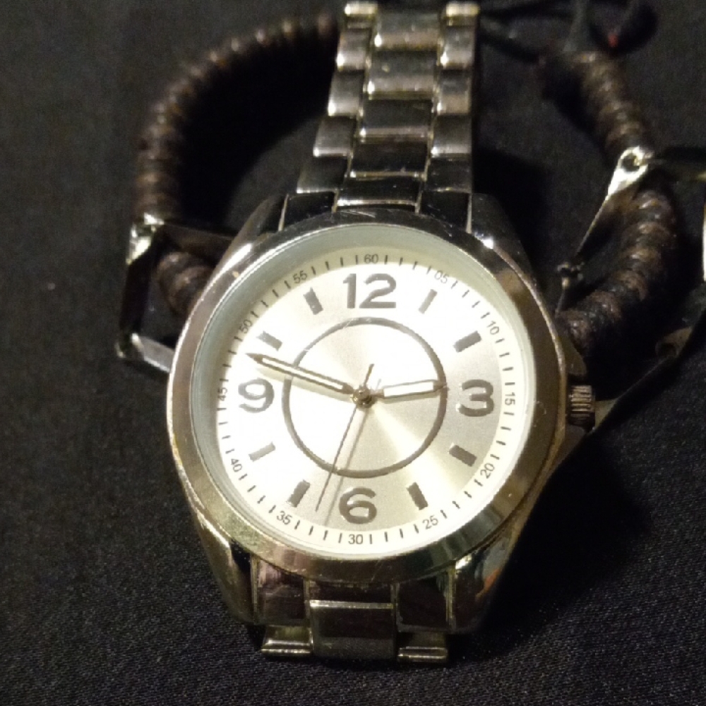 Silver Analog Watch with silver band. Leather bracelet and a silver bracelet.